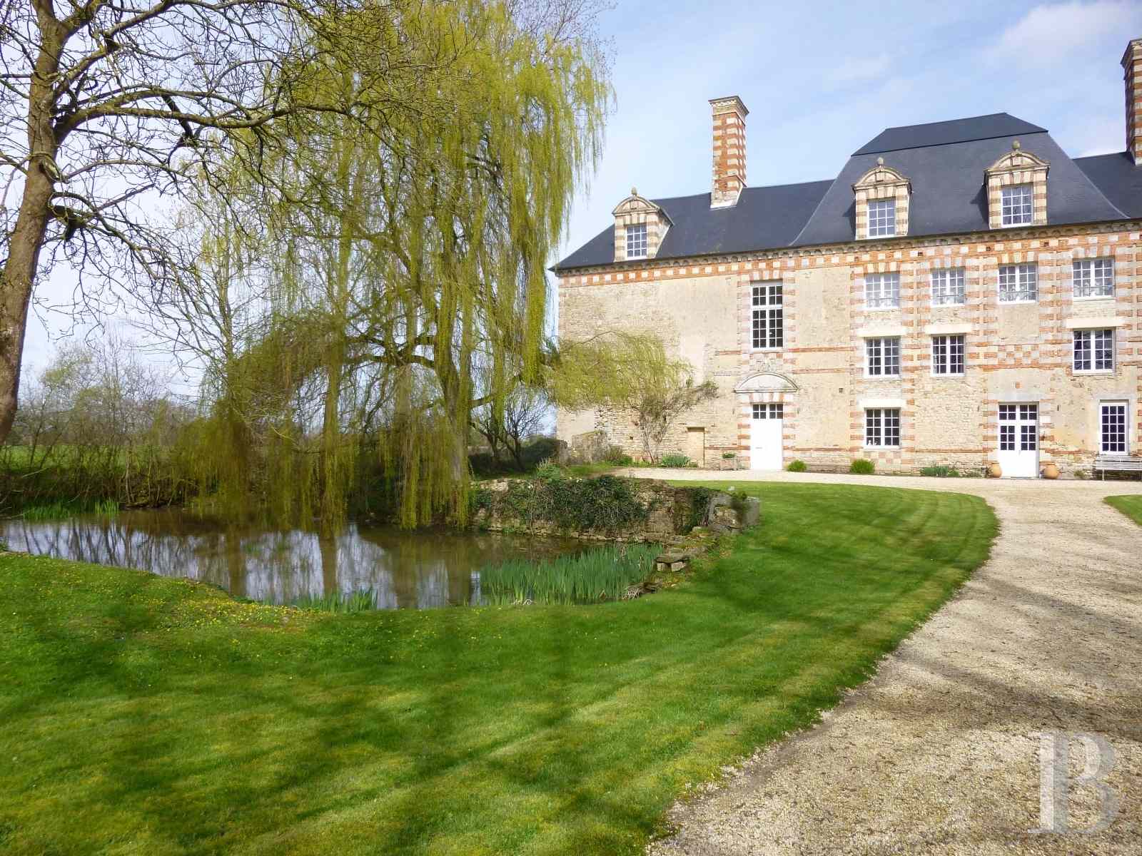A 17th century chateau and its 16th century dovecote surrounded by