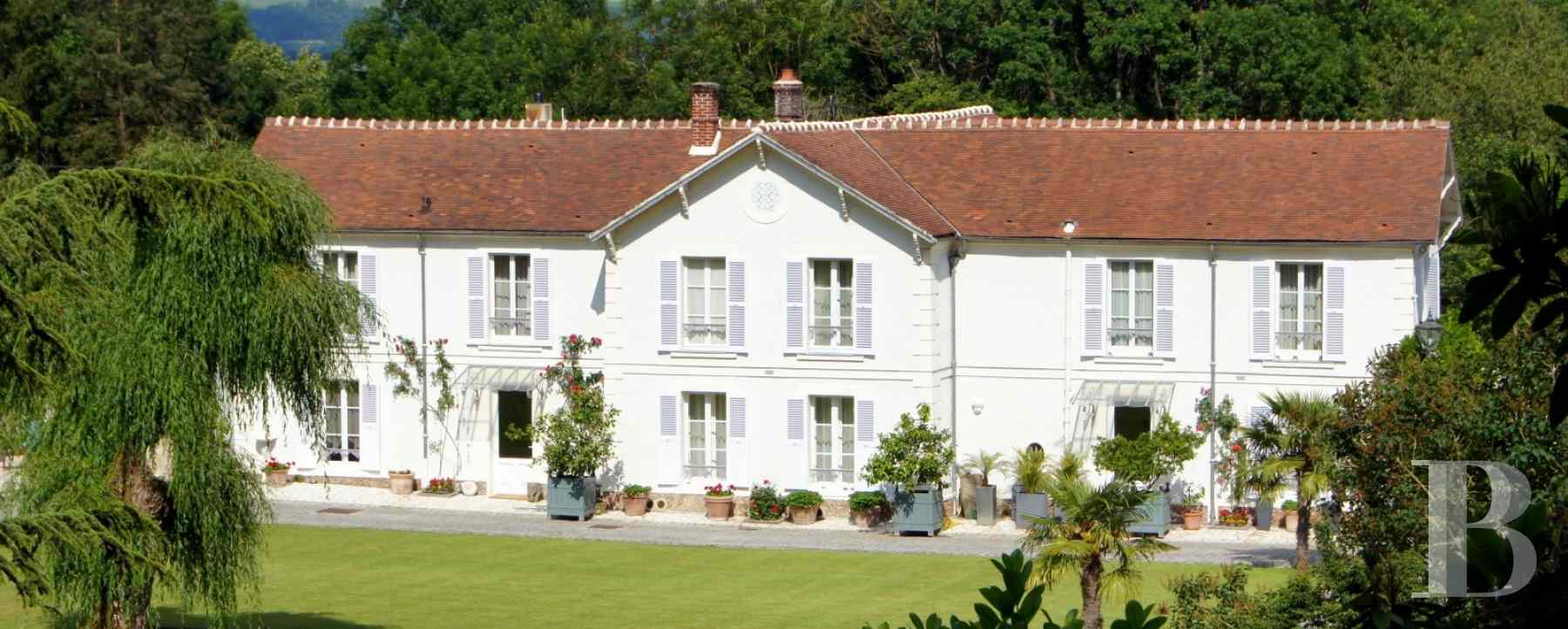 A 19th century manor house with outbuildings in SeineetMarne, less