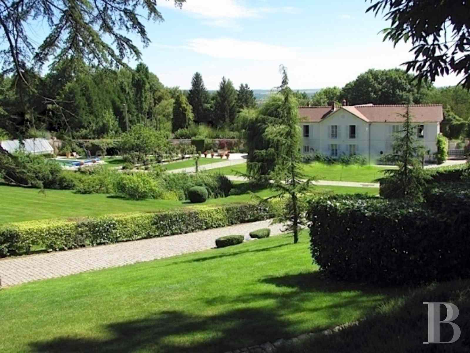 A 19th century manor house with outbuildings in SeineetMarne, less