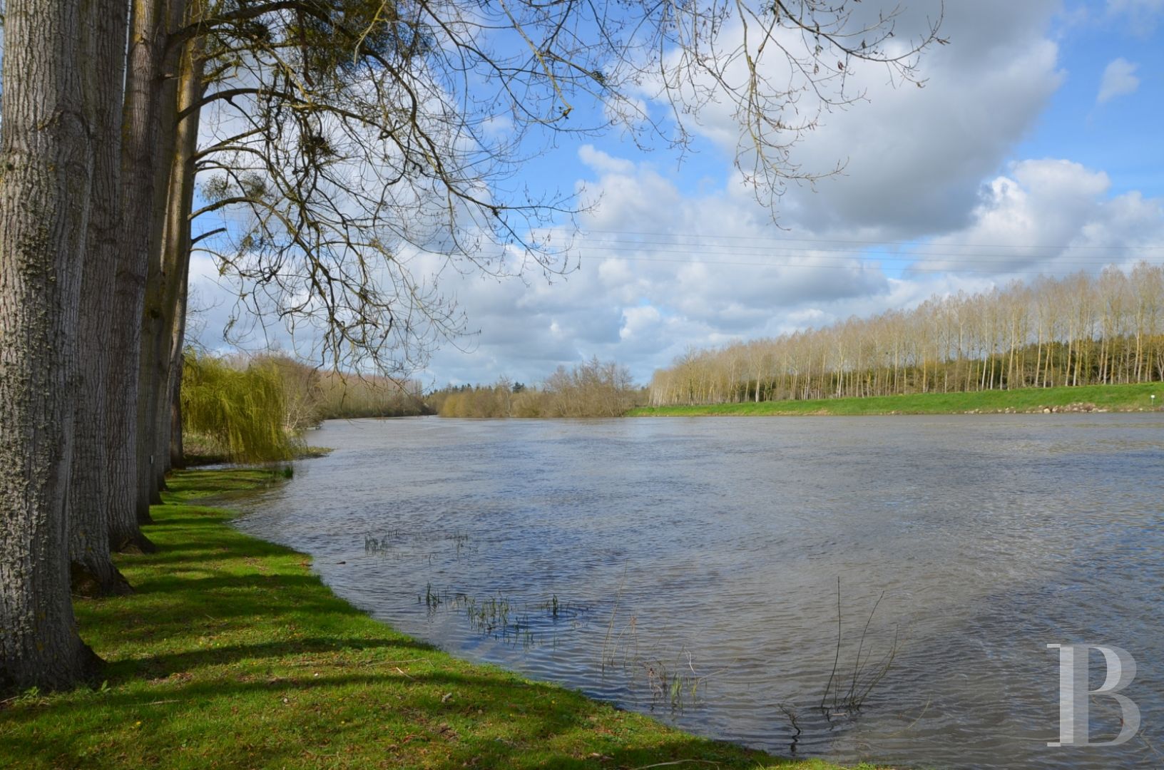 A renovated, 17th century mill, like a liner protruding from the waves