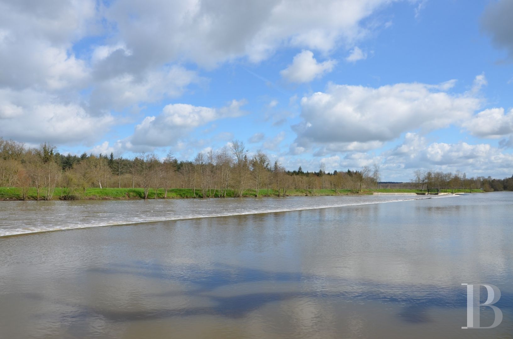 A renovated, 17th century mill, like a liner protruding from the waves