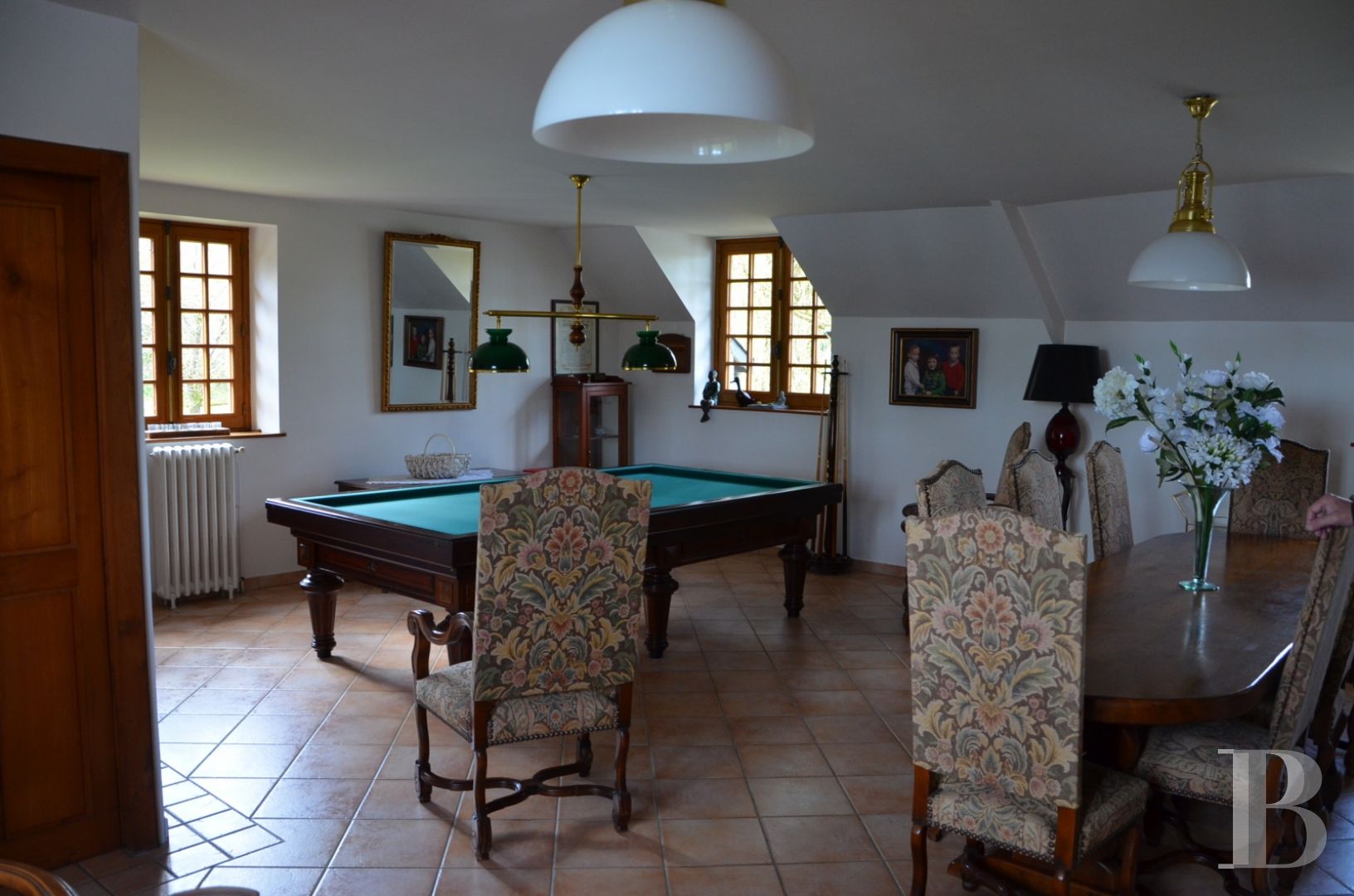 A renovated, 17th century mill, like a liner protruding from the waves