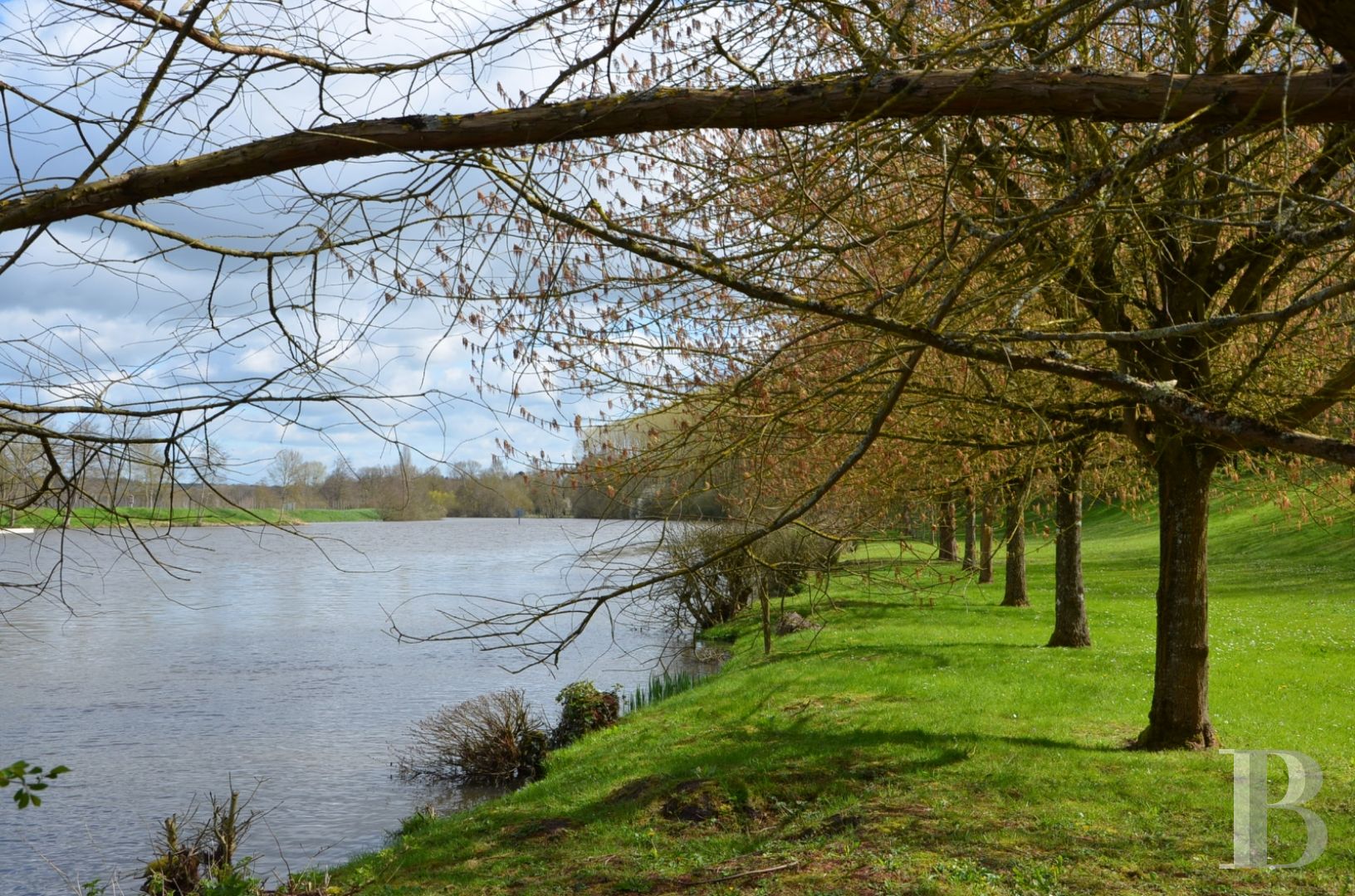 A renovated, 17th century mill, like a liner protruding from the waves